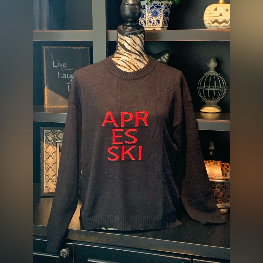 Black sweater with Après-ski in red.